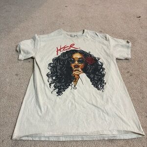 Spencer's Cream Graphic Tee with Red and Black Design